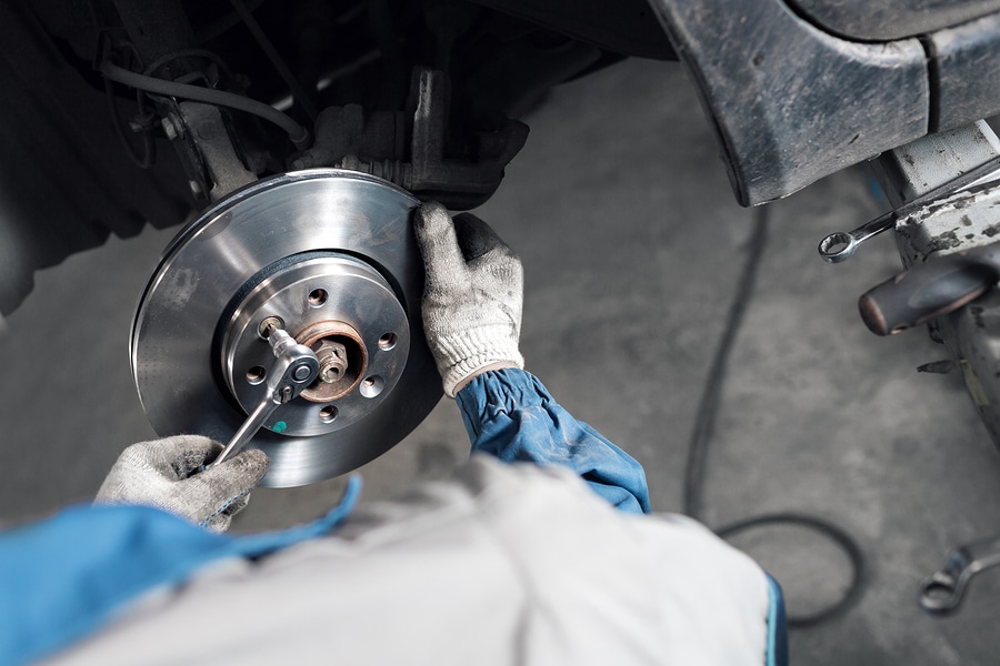 It’s vital that you have regular brake maintenance performed to remain safe on the road. Once you understand the process and what needs to be accomplished, you’ll know when to take your car in for brake service. Each component of your brake system needs attention. There are five to think about: the master cylinder, lines, calipers, rotors, and pads. To fully maintain your brake system, you’ll need to understand what each of these does. Master Cylinder & Brake Lines A vehicle’s brakes run hydraulically. Fluid transfers the power from your foot pedal and sends it to the brakes themselves. Your master cylinder is the beginning place for your power flow. If this is faulty, you won’t exert enough power to get the fluid to your brakes. It’s important to have your mechanic inspect your brake lines and master cylinder for any sign of damage. They all need to check your brake fluid for cleanliness. Calipers, Rotors & Pads The calipers, rotors, and pads work in conjunction with each other to stop your vehicle. Once you step on the brake pedal, your master cylinder sends the fluid to your calipers. These squeeze together and exert pressure on your brake pads. That’s why you want to inspect the calipers for damage or wear. When your calipers squeeze together, the brake pads clamp down onto the rotor of your car. This slows your car down. If the pads are worn out, then they can’t make the proper contact with your rotors. This might lead to further damage to the rotors. You’ll probably end up with uneven grooves or rough spots. Besides, the rotors experience lots of heat and friction, so they often warp over time. You don’t want to wait until you need rotors to fix your trouble. It will cost you far more than brake maintenance does. Many brake pads come with a wear indicator, so you know when you need to replace them. A tell-tale sign is when it begins making a squealing sound. Brake Maintenance Schedule It’s vital that you stick to a specified brake maintenance schedule for the best results. You’ll want to look in your owner’s manual to find out what’s recommended for your make and model. As a general rule of thumb, you could also follow these guidelines: Every 12,000 miles – inspect the brake pads and brake fluid. If there’s less than a 1/8-inch on the pad lining, you’ll want to replace them. If the brake fluid is dirty, you need to replace it. Every 25,000 miles – most manufacturers recommend changing the brake fluid. Every 60,000 miles – replace or resurface the rotors, so they are smooth again. Keep in mind you can usually only resurface the rotors once per set. Your mechanic knows when these concerns need to be dealt with, so be sure to discuss a regular brake maintenance schedule with them. Brake Maintenance Cost Maintaining your brake system is vital if you want to remain safe on the road. Taking proactive measures not only protects you, but it’s also cheaper than fixing issues resulting from negligence. Installing new brake pads and also resurfacing your brake rotors typically runs anywhere from $60 up to about $200, depending on what vehicle you drive. On the other hand, brake repair requires you replace the pads and rotors. This could run you up to $1,000. See the difference? Don’t ever take chances with your braking system; your safety relies on it. This isn’t the area of car maintenance you want to procrastinate with. Brake Wear Factors There are multiple reasons your brakes might wear out faster than others. That’s why you should perform regular inspections. Here are some of the factors to consider. Your Driving Habits – if you regularly haul heavy loads or a trailer, you might wear down brakes faster. If you prefer to keep plenty of space between you and the drivers in front of you, your brakes probably last longer thanks to your prudent driving skills. Where You’re Driving – for people commuting daily through the city, they have more stop and go traffic to contend with compared to a highway driver. The brakes are sure to wear more quickly. That’s also the case if you spend a lot of time on mountainous highways. If you go off-roading at all, the grime and dirt help to degrade brake components faster. Slide Pin Corrosion – because your caliper must slide evenly and smoothly, a corroded slide pin causes you to end up with brake pad wear. That’s because the pad remains in contact with your rotor at all times. Installing Cheap Pads – there’s a wide range of pads on the market to replace yours with. There’s a variety of prices, and many people opt for the cheapest to save some money. These don’t often last as long and might even contain some metal chunks that wear out your rotors faster. Spending a little more helps to prolong the life of your brakes. A premium set of brake pads might last you 50,000 miles. What is ABS? ABS stands for the anti-lock braking system, and all modern cars come equipped with it. This system works to prevent your wheels from locking up which maintains a grip on the road. When your ABS warning light is illuminated, it means the system has seen a malfunction and is disabled. Your brakes continue to work regularly, but the anti-lock feature won’t. If you have traction or stability control, those systems also become disabled. Some of the leading causes of this include: • A blown fuse • A damaged wheel-speed sensor or one that’s covered in dirt • An ABS controller which quit working • A broken wire located between your ABS controller and the sensors Checking Brakes for a Road Trip If you plan to head out on the road for an extended time, or you travel in remote areas, then you’ll want to inspect your brake system first. Take the car to your service center for peace of mind. They will look over the entire system to ensure your safety on the road. You want to replace any worn or faulty components now so you can enjoy the trip. Before You Have Your Brakes Worked On If you plan to have your brake system worked on by a professional, there are several things you’ll want to check into before turning over your vehicle. 1. Make sure they’re using premium brake pads. Generic pads often come in plain boxes. Ask to see the package so you can be sure they have a brand name on them. 2. Don’t fall into the ceramic brake pad scheme. Many shops want to recite how much better they are and why you should upgrade. They don’t last longer, and they aren’t better material. All they offer is less brake dust, and they run quieter. 3. Check the brake rotors. Many shops purchase inferior rotors for rock-bottom prices and then charge customers premium prices. Make sure you see the rotors they plan to install and only opt for high-quality brands. The top brake shops use well-known brands such as Bendex, Raybestos, Wagner, NAPA/United, Carquest, Motorcraft, ACDelco, and Brembo. These are the products you want on your car for maximum protection. Make sure you take the time to have a mechanic regularly inspect and service your brakes. It’s vital for your safety and everyone else on the road.