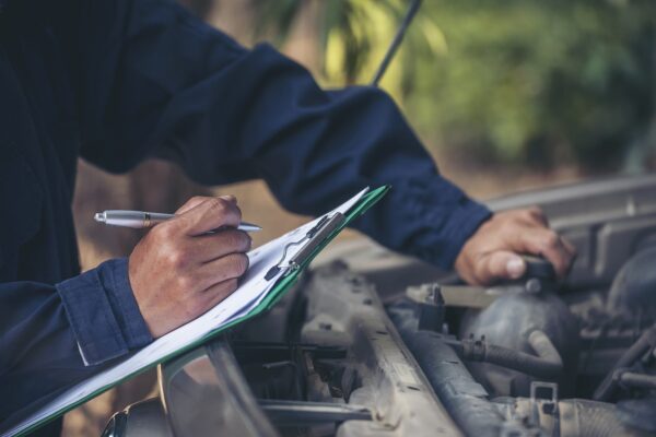 Image of a mechanic working on a vehicle on Hollenshade's automotive services website